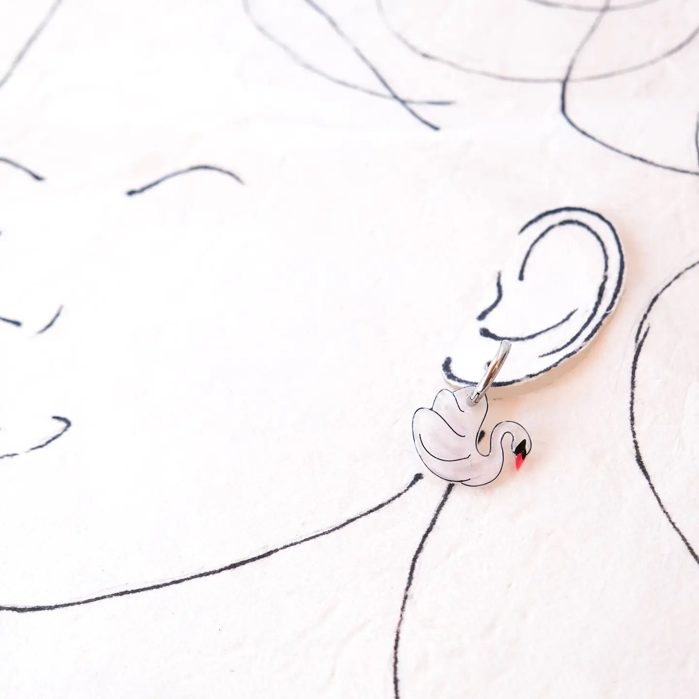 White Swan Elegant Silver Huggie Hoop Earrings