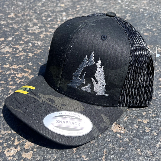Sasquatch in Trees Trucker Hat - Black Camo